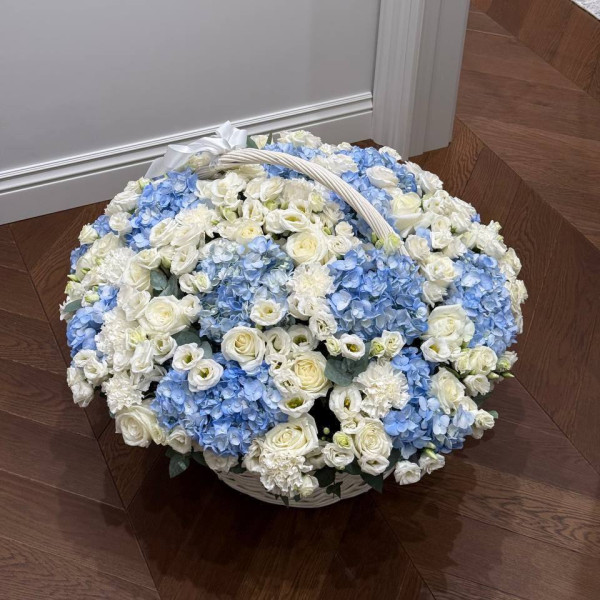 Large basket with hydrangeas, roses and eustoma